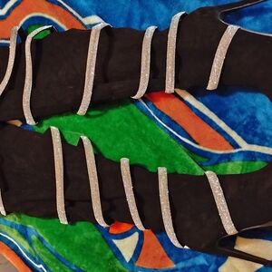 Black Thigh-High Boots with Silver Straps